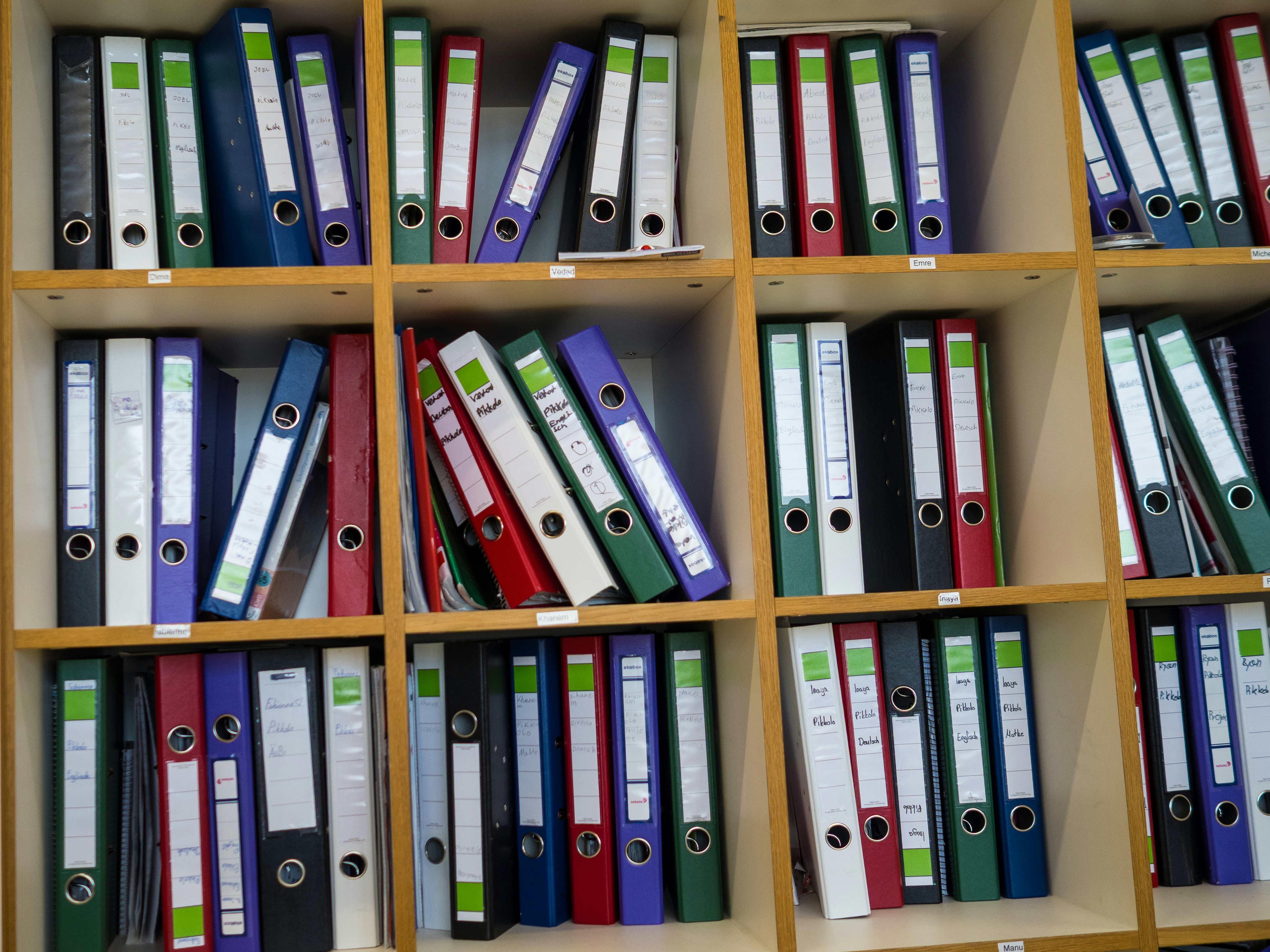 Shelves filled with colorful binders and folders